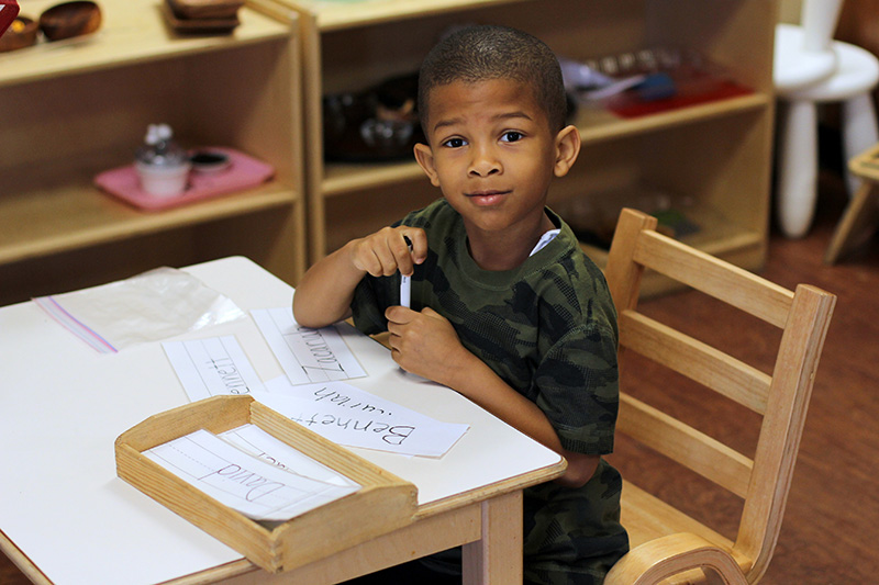 santan charter school learn happy kid at desk