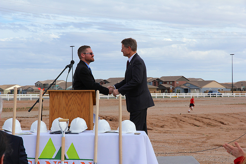 santan charter school our history men shaking hands